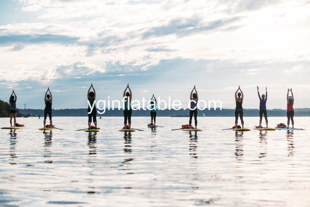 Yoga on the inflatable paddle board
