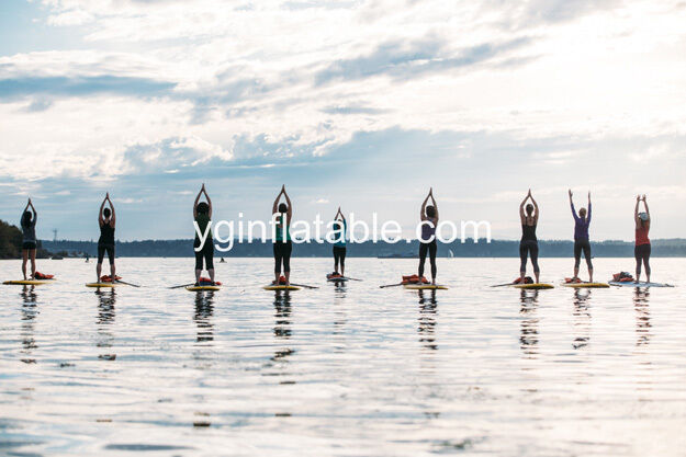 Yoga on the inflatable paddle board